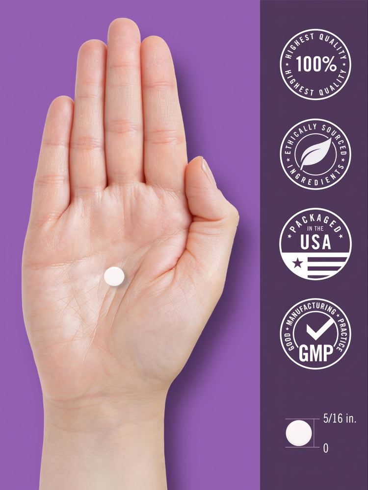A white, round tablet rests on a hand, measuring 5/16 inches.