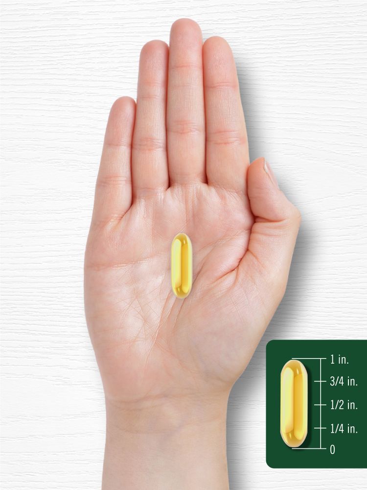 A yellow softgel is displayed alongside a 1-inch measurement scale for size reference.
