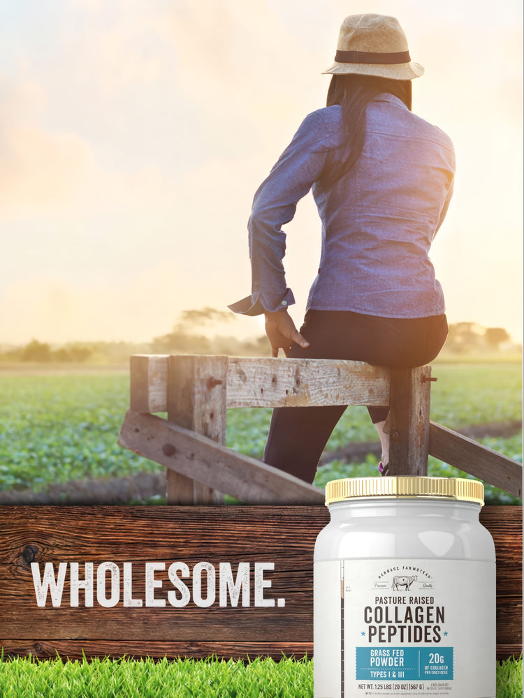 A woman sits on a wooden fence at sunset, gazing at a field with a jar of Collagen Peptides beside her.