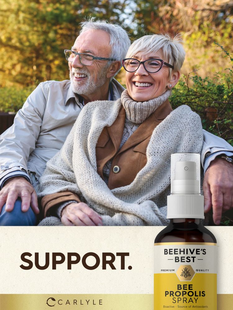 Carlyle Bee Propolis Spray 2 fl oz bottle with a smiling older couple seated in the background.