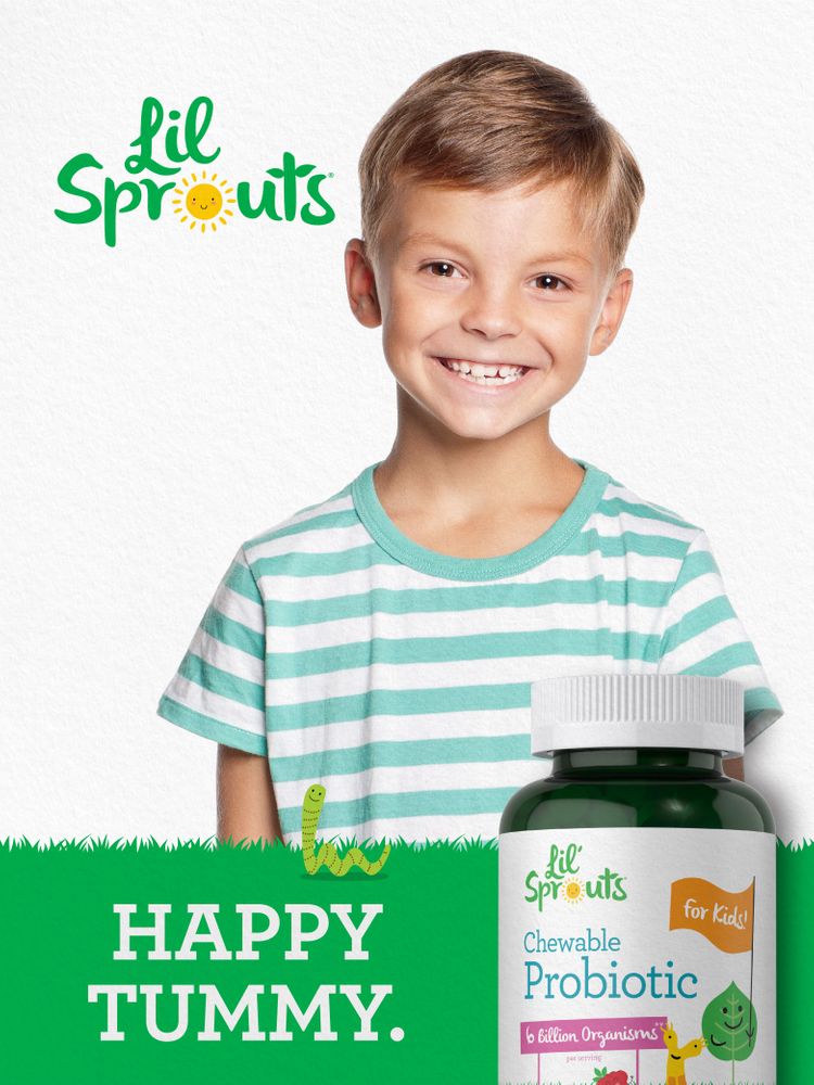 A young boy smiles next to a Lil' Sprouts Chewable Probiotic bottle.