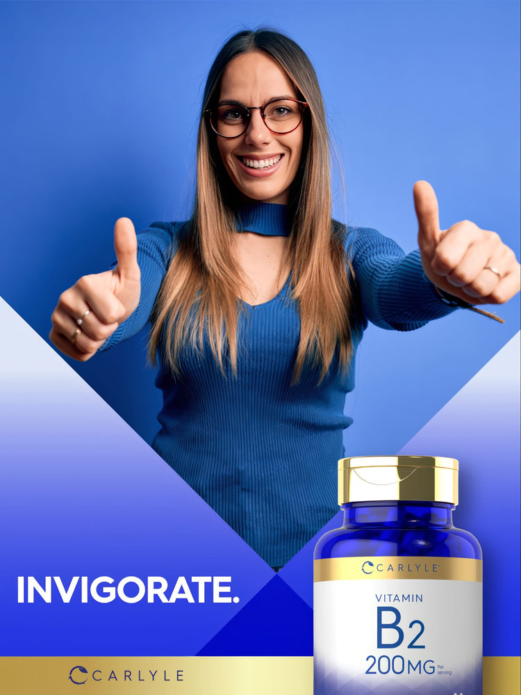 Carlyle Vitamin B2 capsules, 200mg, shown on a hand for size reference.