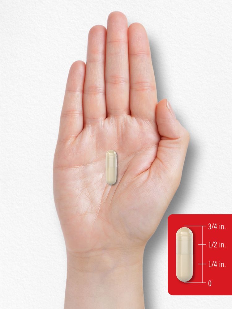 A small capsule measuring three-fourths of an inch in length, shown on a hand scale for size reference.