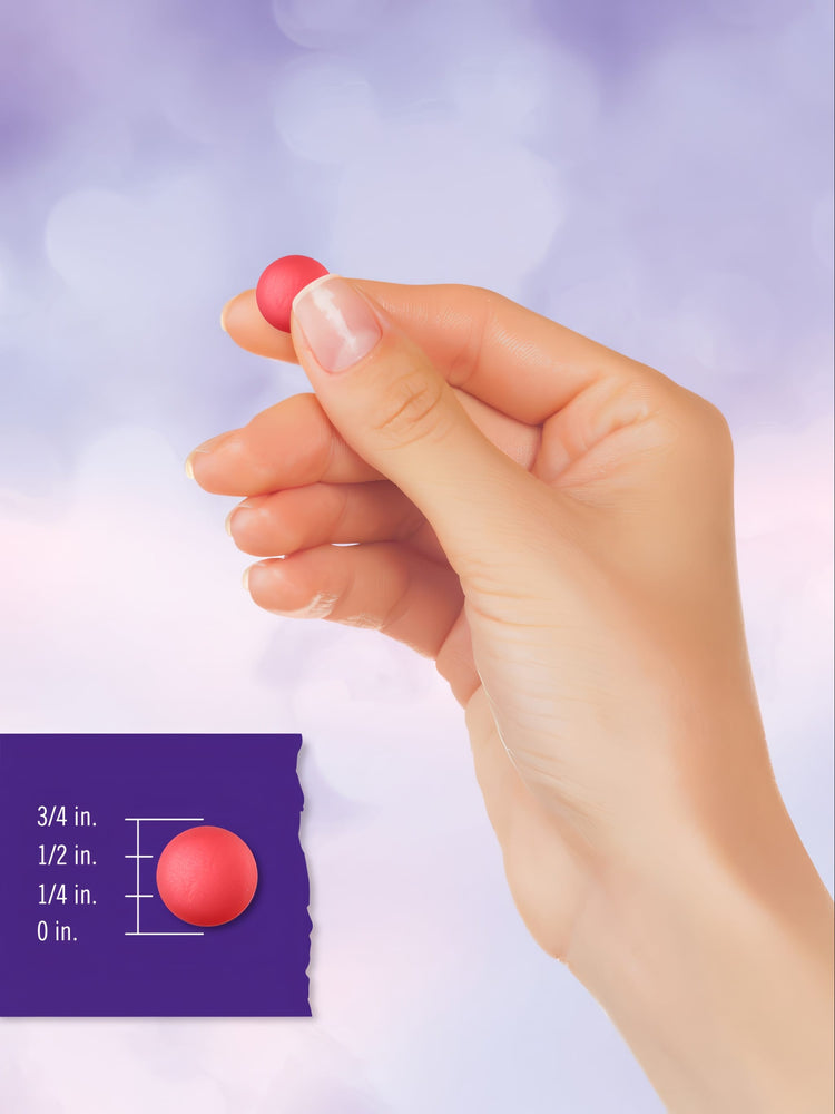 A red gummy, half an inch tall, displayed on a bulk scale to show size and detail.
