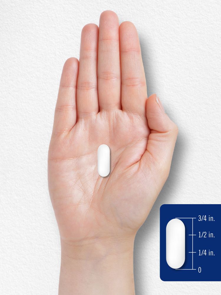 A white oblong caplet approximately three-fourths of an inch long is shown, ideal for illustrating the size or shape of pills.