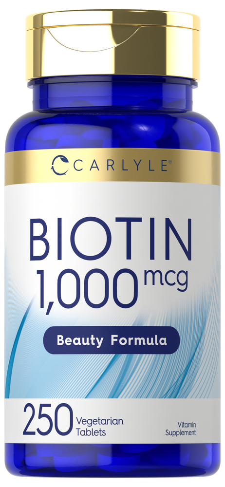 Carlyle Biotin 1,000 mcg bottle with 250 vegetarian tablets sits on a hand scale, indicating product weight and size.
