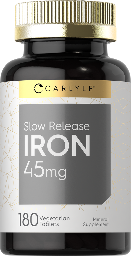 Carlyle Slow Release Iron 45mg with 180 vegetarian tablets shown on a hand scale for size reference.