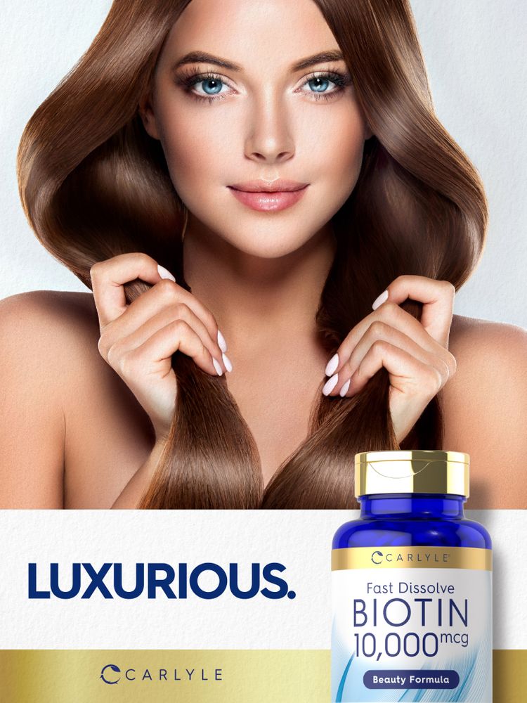 Hand holding a bottle of Fast Dissolve Biotin 10,000 mcg.