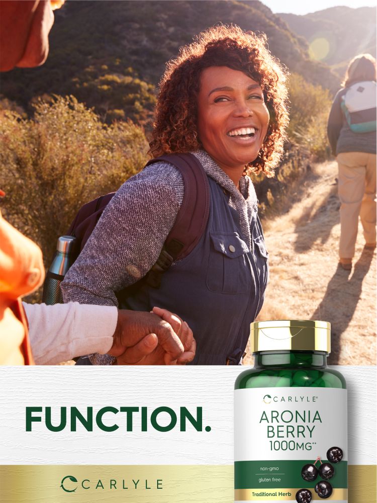 A bottle of Carlyle Aronia Berry 1000MG placed on a hand scale, showcasing its compact size and easy portability.