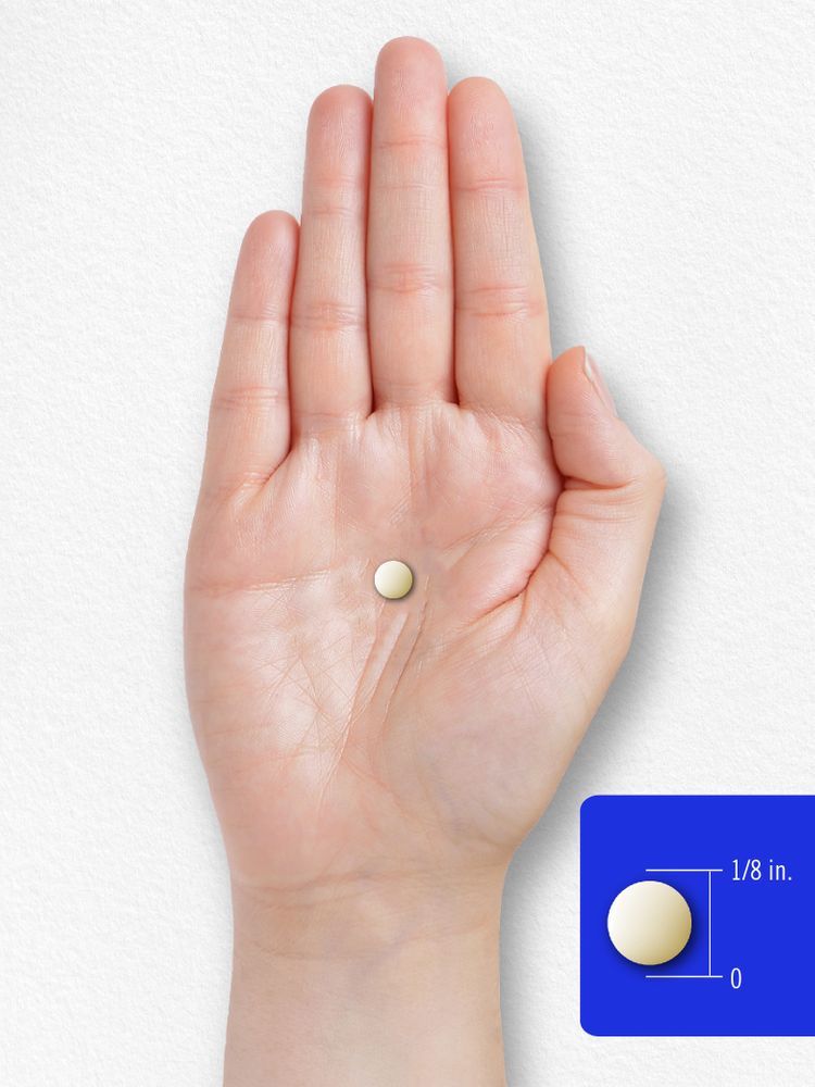 A small round tablet, 1/8 inch in diameter, lying on an open palm.