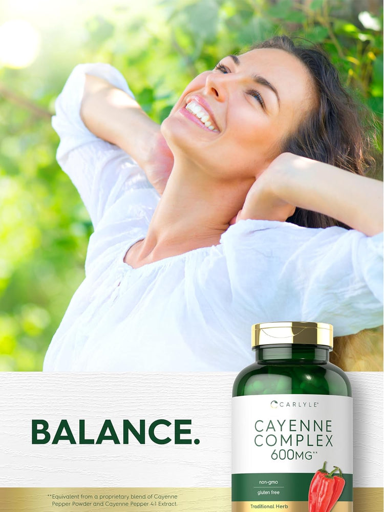 A young woman relaxes outdoors, smiling while holding a Carlyle Cayenne Complex bottle.