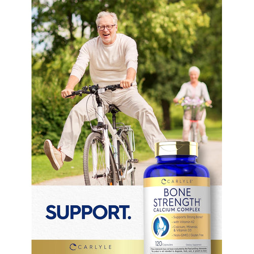 View 6 An older man smiles on a bicycle with a woman in the background, next to Carlyle Bone Strength.