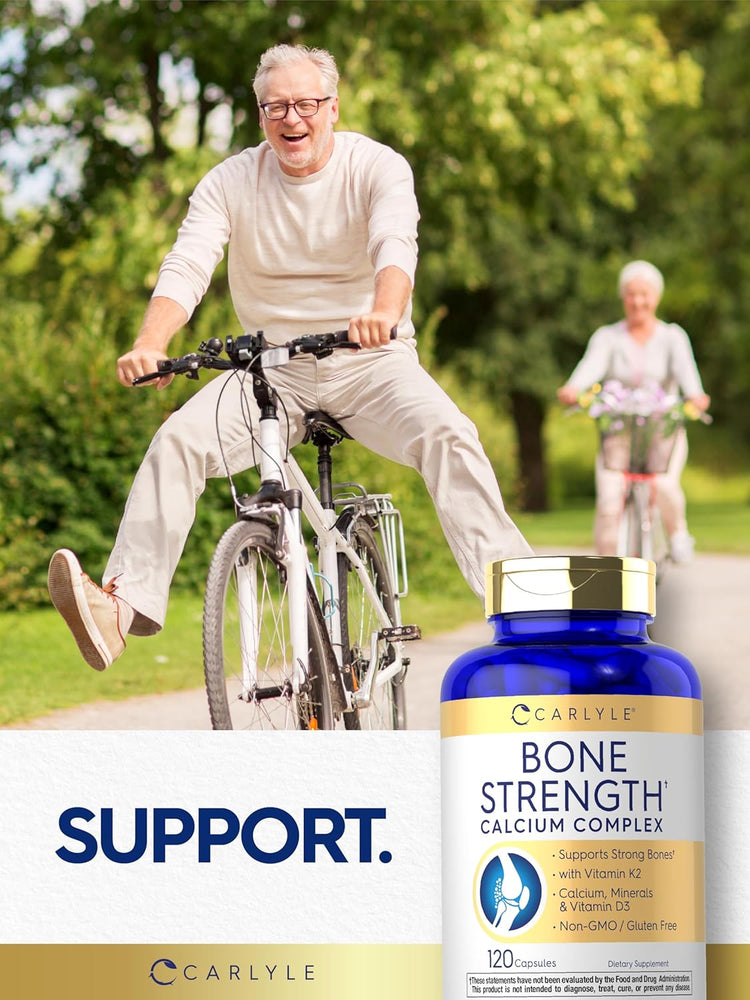 An older man smiles on a bicycle with a woman in the background, next to Carlyle Bone Strength.