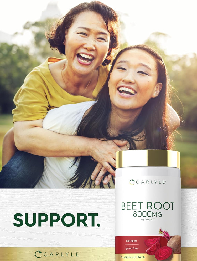 Two smiling Asian women, one older, one younger, enjoying a piggyback ride outdoors with a Carlyle Beet Root bottle.