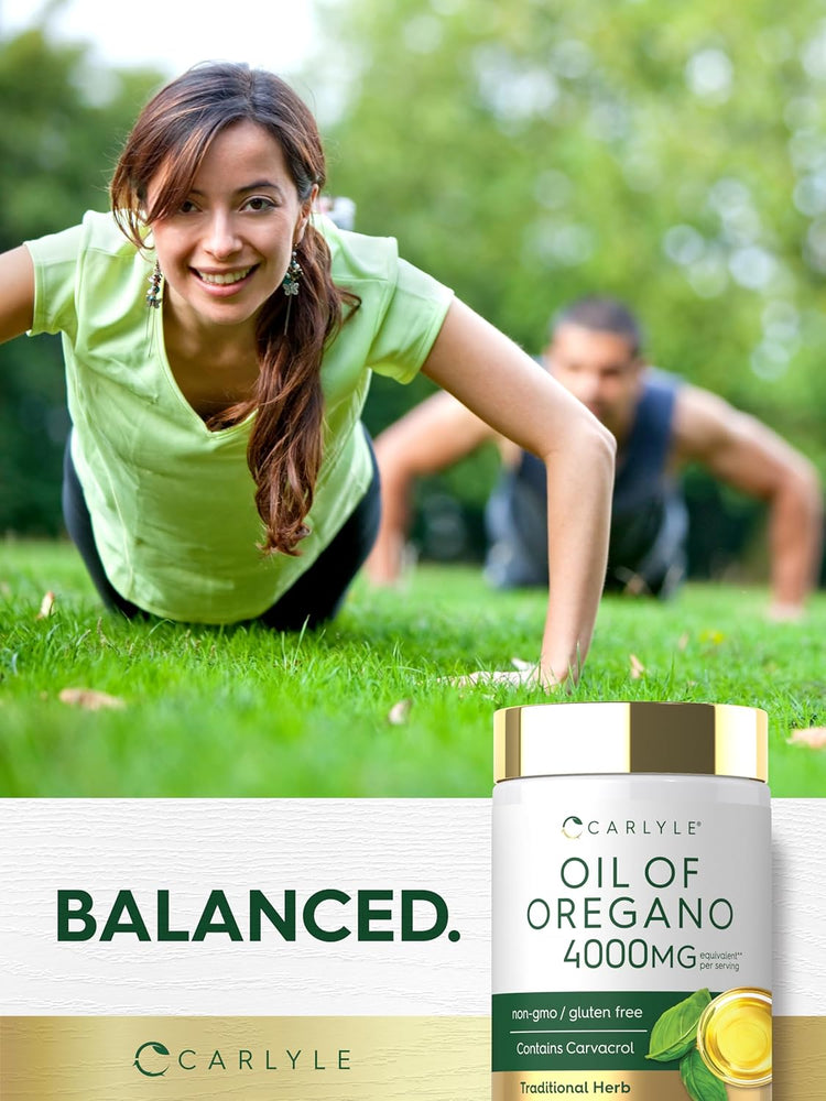 A woman and man doing push-ups in a park beside a Carlyle Oil of Oregano bottle for exercise.