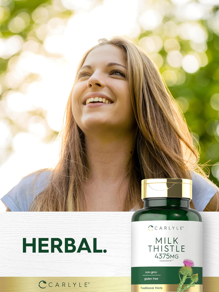 A young woman smiles while looking up outdoors, holding a bottle of Carlyle Milk Thistle.