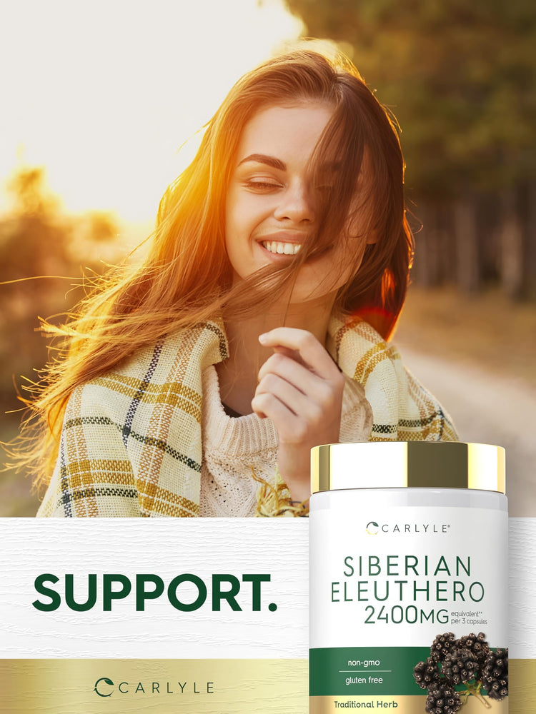 A young woman smiles with sunlight on her face and hair, standing next to a Siberian Eleuthero bottle.