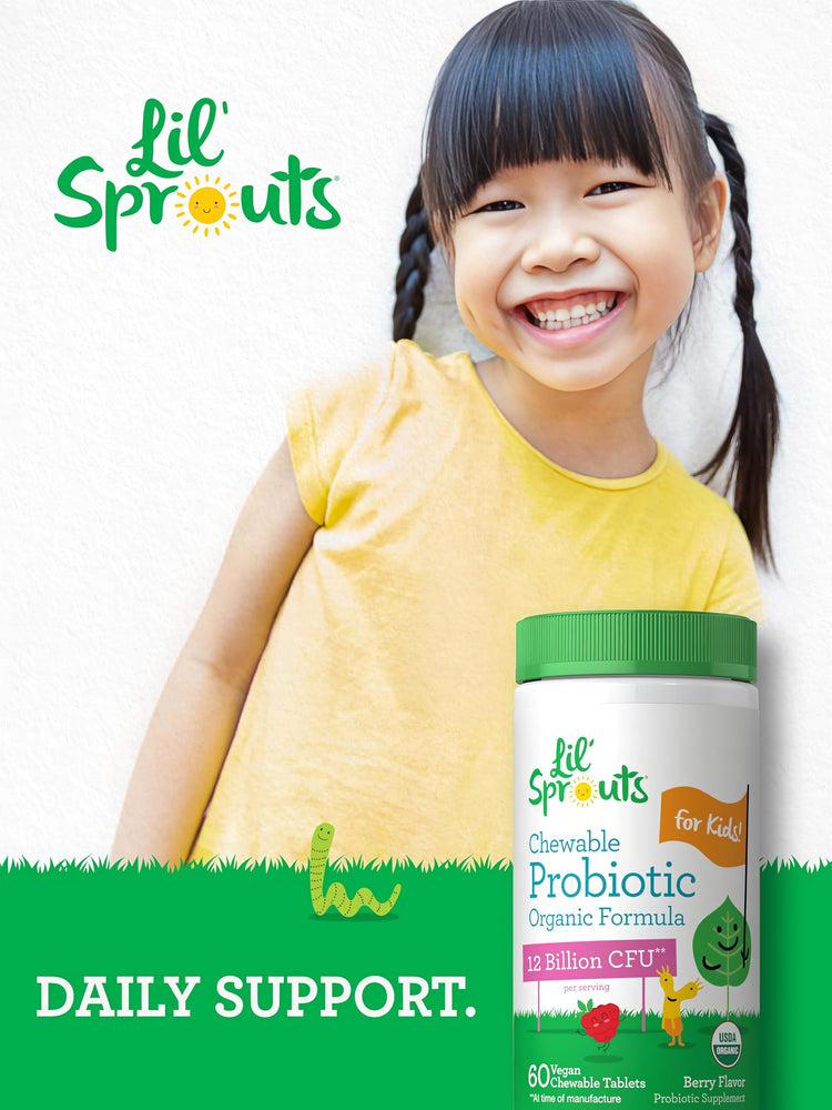 A young girl smiling brightly while holding a bottle of Lil' Sprouts Chewable Probiotic.
