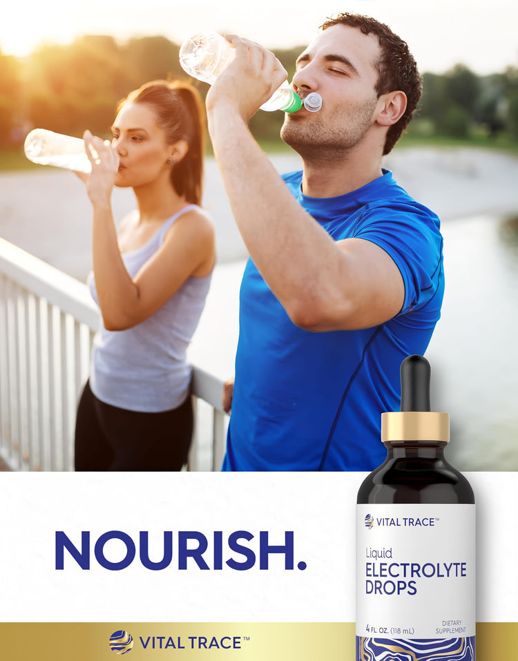 A young man and woman hydrate with water bottles next to Carlyle Electrolyte Drops.