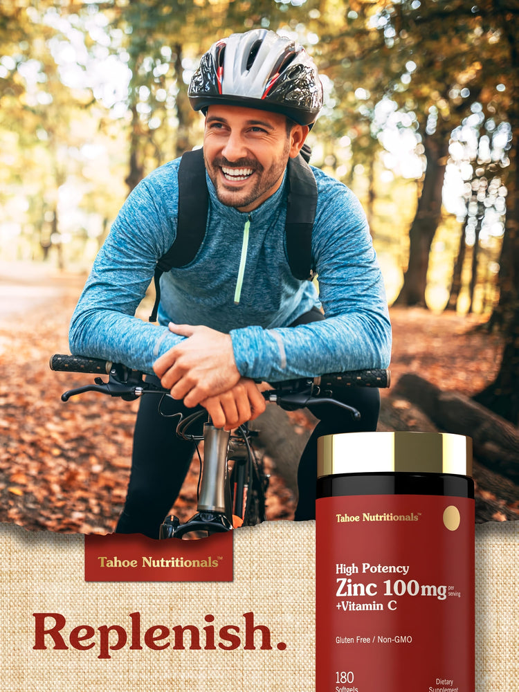 A middle-aged man cycling outdoors, smiling while holding a bottle of Tahoe Nutritionals Zinc + Vitamin C.