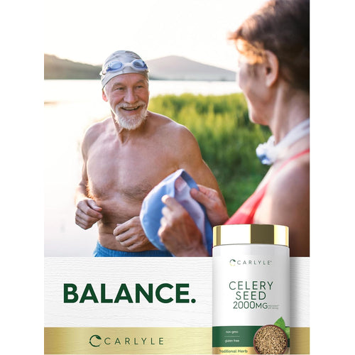 View 6 Older man in swim cap and goggles smiles by a lake, receiving a towel from an older woman, with a Celery Seed bottle nearby.