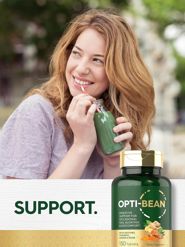 A young woman smiles while drinking a green smoothie, holding an Opti-Bean bottle.