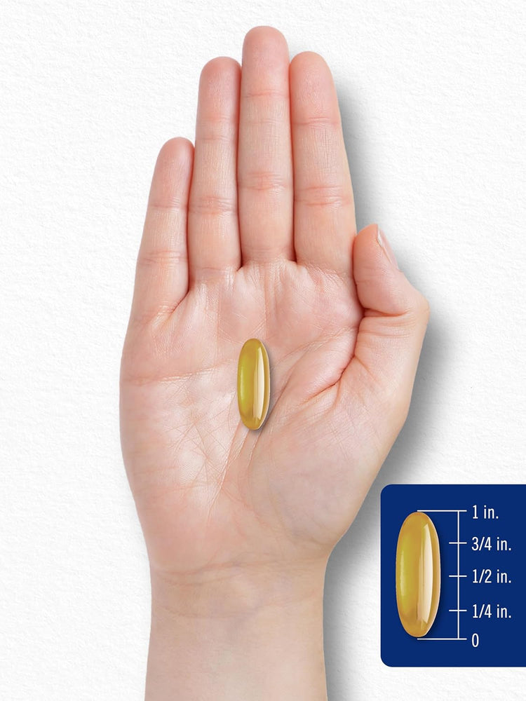 A yellow softgel capsule is displayed next to a ruler, measuring 1 inch in length.