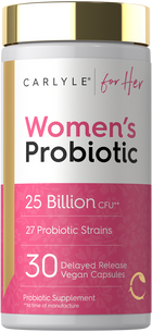 A hand holding a bottle of 30 delayed release vegan capsules, displayed on a scale.