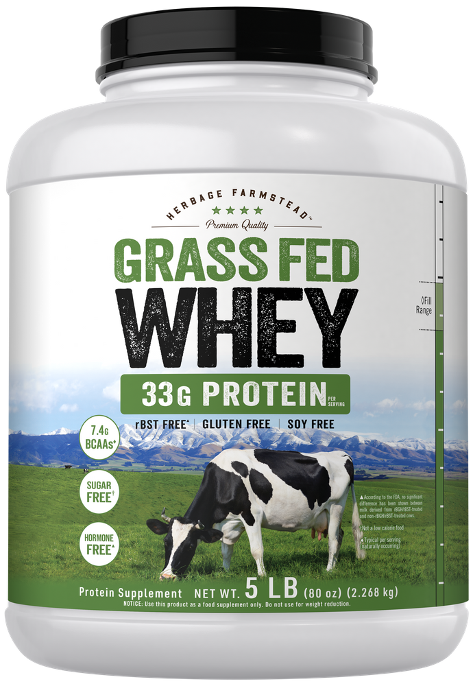 A large white tub of Grass Fed Whey protein powder, weighing 5 LB (80 oz) or 2.268 kg, on a bulk scale.