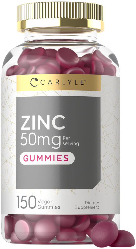 Zinc 50mg gummies are red, flat, and round, shown inside and spilling from a clear bottle.