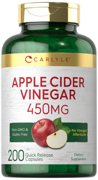 A hand holds a bottle of 200 Carlyle Apple Cider Vinegar 450 mg Quick Release Capsules on a scale.