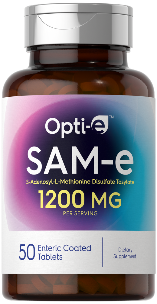 Hand holding Opti-e SAM-e 1200 MG enteric coated tablets, scale indicating bulk size.