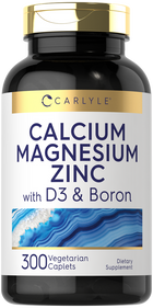 Carlyle Calcium Magnesium Zinc with D3 and Boron, 300 vegetarian caplets shown on a hand scale.