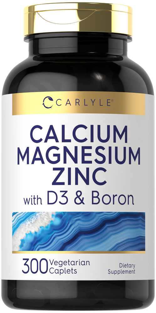 Carlyle Calcium Magnesium Zinc with D3 and Boron, 300 vegetarian caplets shown on a hand scale.