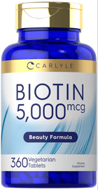 Carlyle Biotin 5000 mcg with 360 vegetarian tablets on a hand scale.