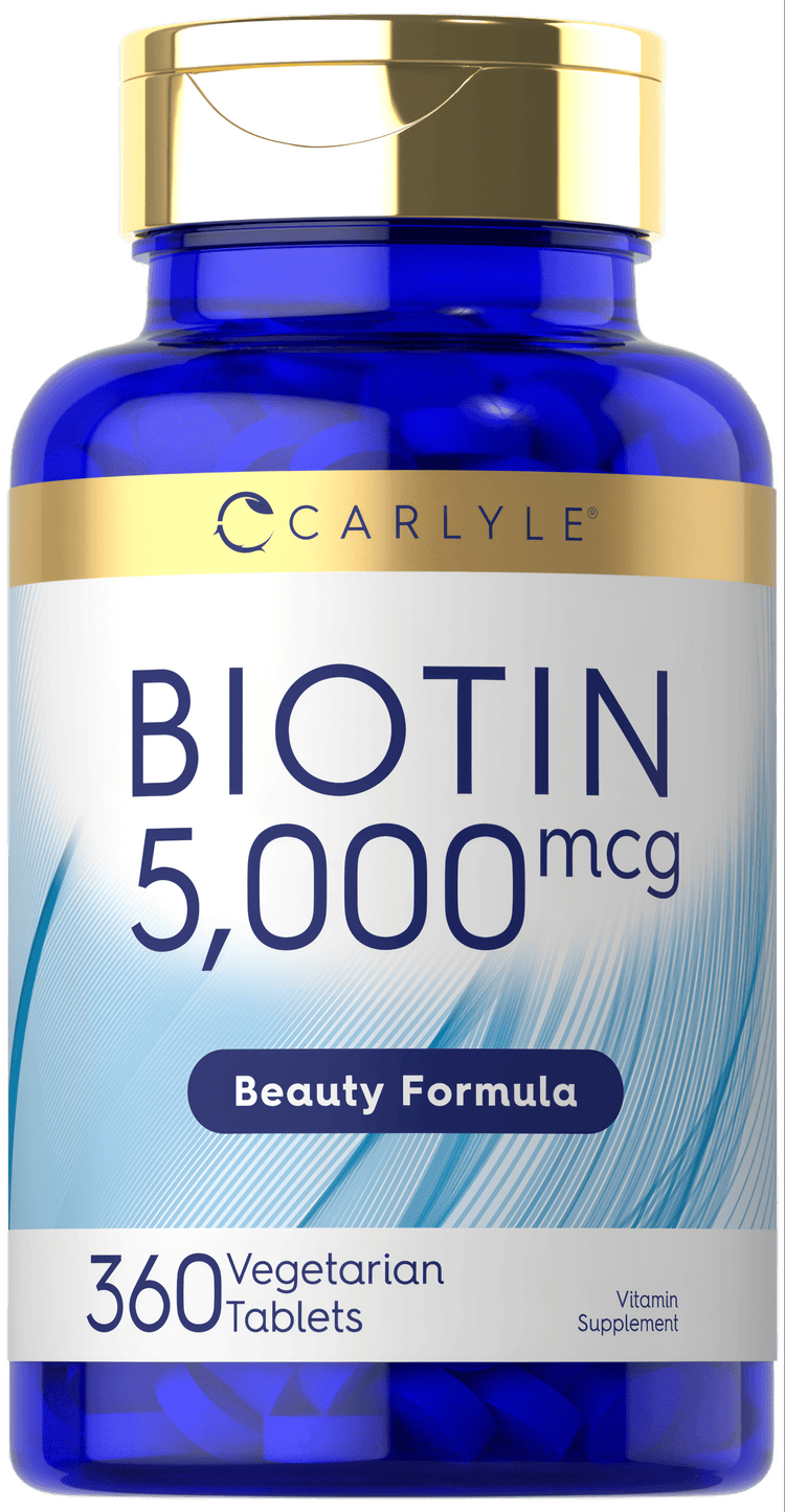 Carlyle Biotin 5000 mcg with 360 vegetarian tablets on a hand scale.