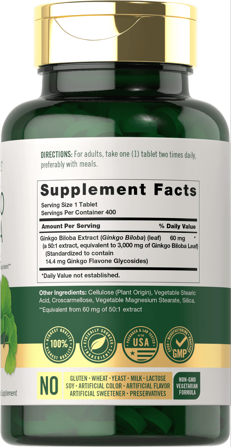 A hand holding a bottle of Carlyle Ginkgo Biloba with 400 tablets, emphasizing the product's bulk size and potential health benefits.