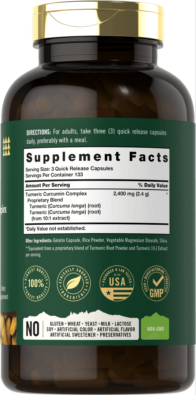Hand holding a bulk scale bottle of Turmeric 800 mg Quick Release Capsules, containing 400 capsules.