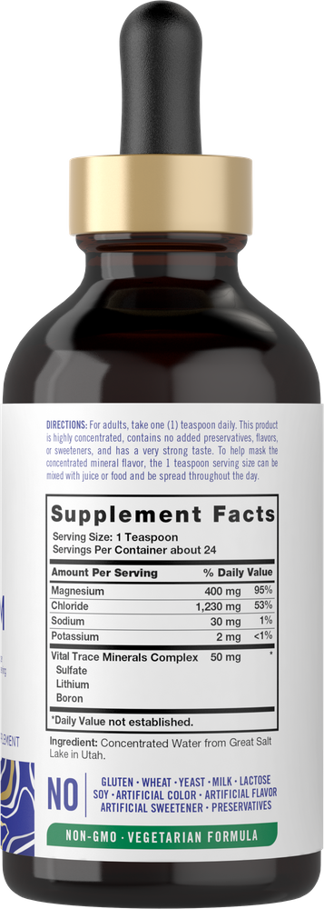 A 4 fl oz bottle of CL Carlyle Liquid Ionic Magnesium 400mg with a dropper, shown on a hand scale for size comparison.