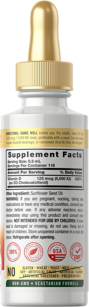 Hand holding a 2 oz bottle of liquid Vitamin D3 5000 IU.