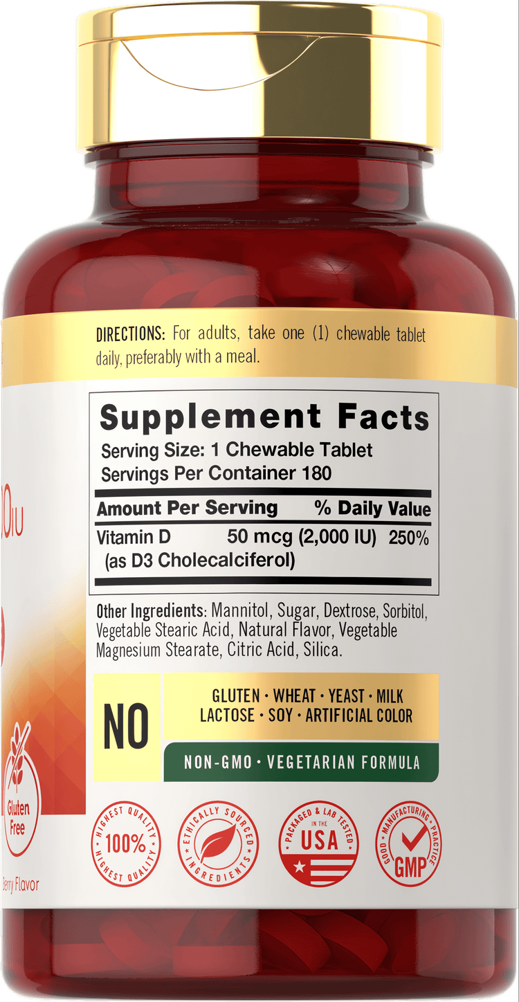 Hand holding a bottle of Vitamin D 2000 IU Chewable tablets, 180 count.