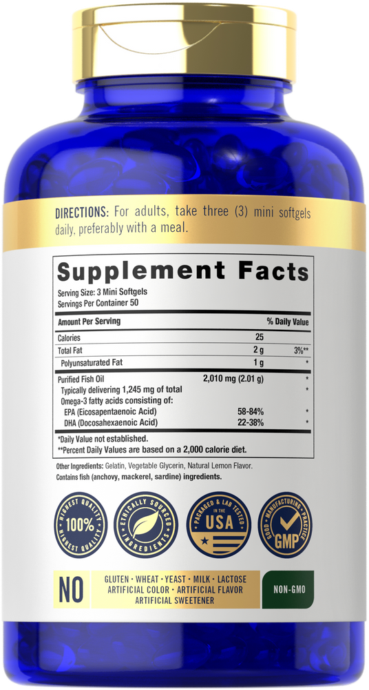 Hand holding mini softgels to show scale.