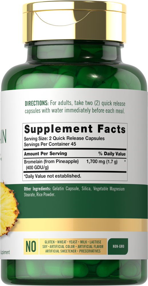 Hand holding Carlyle Bromelain 1700 mg Quick Release Capsules bottle, indicating size and scale of the supplement packaging.
