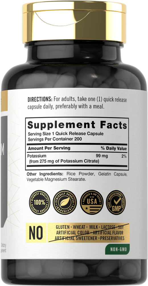 Hand holding a bulk scale with potassium 99 mg capsules, emphasizing supplement dosage and purity for health-conscious consumers.