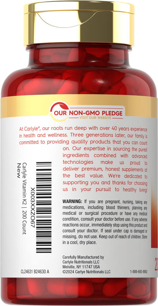 A person's hand holding a bottle of Carlyle Vegan K2 MK7 with 200 veggie capsules, highlighting the product's scale and size.