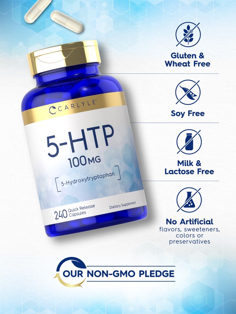 A hand holding two white 5-HTP 100 mg Quick Release Capsules against a bulk surface.