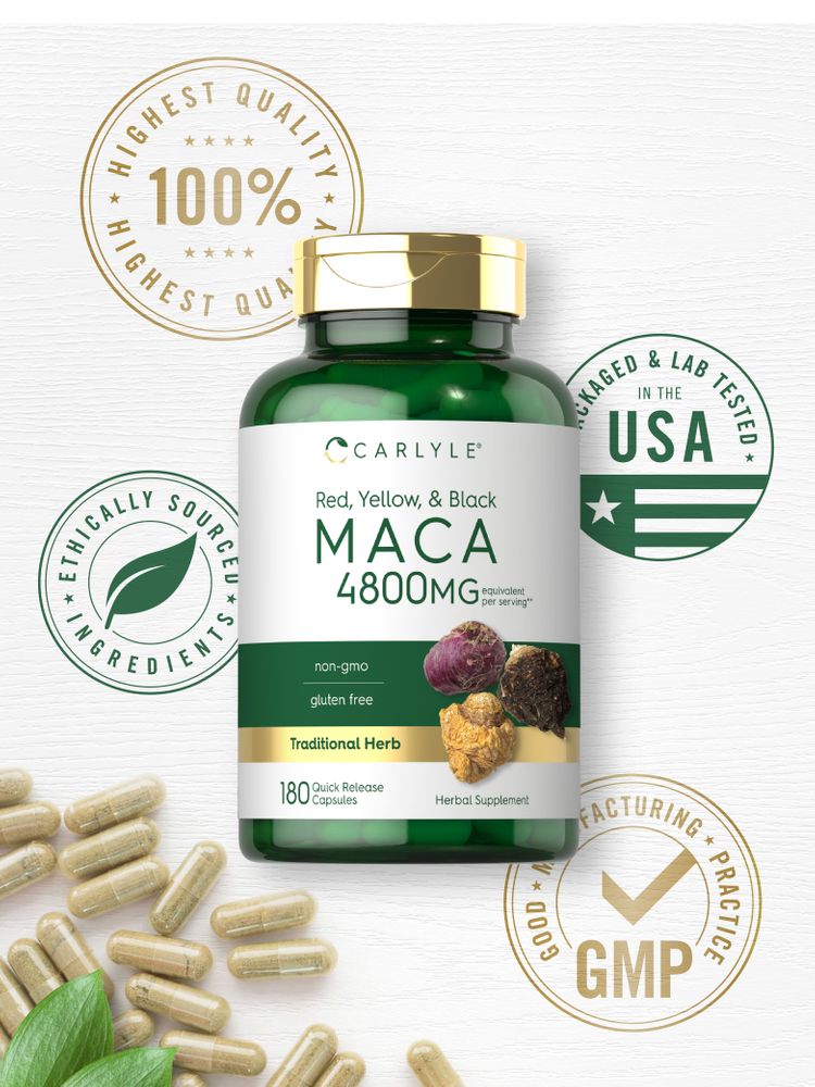 Maca Quick Release Capsules, light brown and translucent, scattered on a white surface with green leaves nearby.