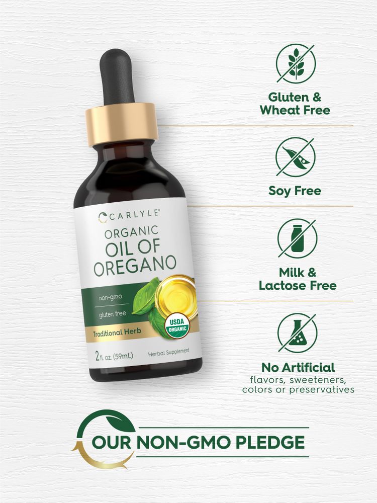 Hand holding a 2 fl. oz. (59mL) dropper bottle of organic oil of oregano, highlighting its size for scale.