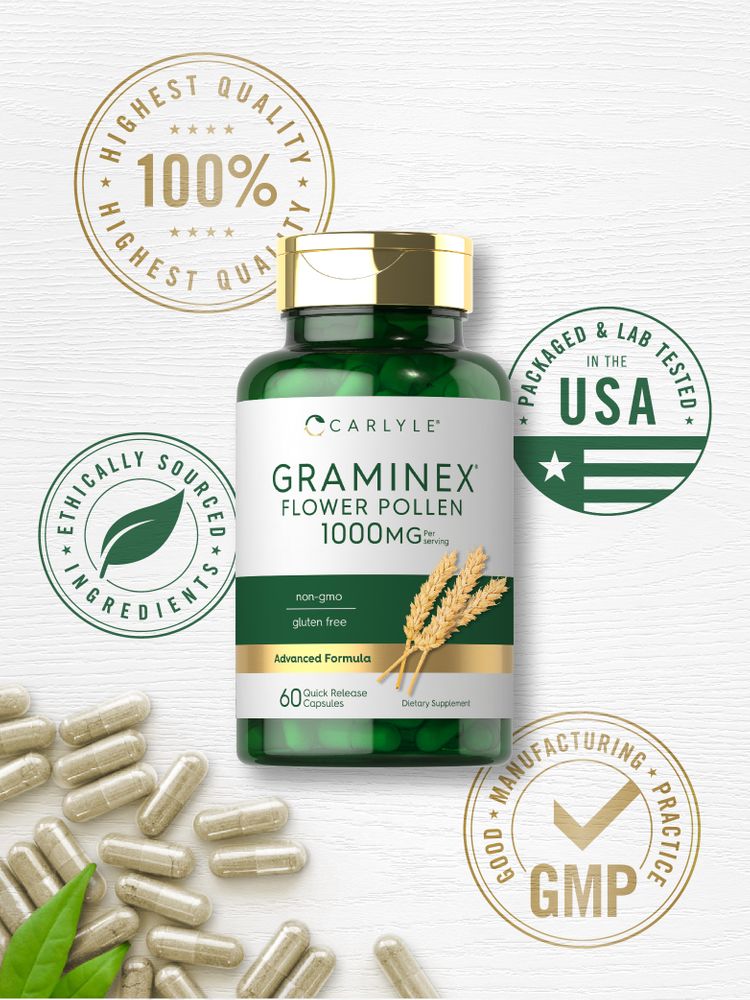 Tan Carlyle Graminex Flower Pollen 1000 mg capsules scattered on a white surface with green leaves.