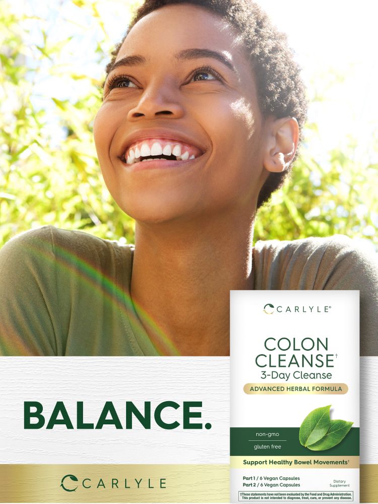 A young Black woman smiling outdoors, looking up beside a Carlyle Colon Cleanse box.